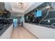Modern kitchen featuring dark marble and light wood cabinets at 12077 Gandy N Blvd # 374, St Petersburg, FL 33702