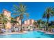 Community pool with surrounding patio and building views at 12077 Gandy N Blvd # 374, St Petersburg, FL 33702