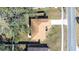 Aerial view of single-Gathering home with driveway and surrounding trees at 1257 Waterfall Dr, Spring Hill, FL 34608