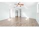 Light and airy bedroom featuring wood-look tile floors and a large closet at 1257 Waterfall Dr, Spring Hill, FL 34608