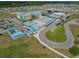 Aerial view of community, including a school and residential homes at 12609 Pensacola Ct, Riverview, FL 33579