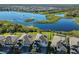 Aerial view of houses near a lake with conservation area at 12609 Pensacola Ct, Riverview, FL 33579