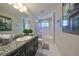 Modern bathroom with granite countertop and bathtub at 12609 Pensacola Ct, Riverview, FL 33579