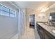 Bathroom boasts a double vanity, shower/tub combo, and tile flooring at 12609 Pensacola Ct, Riverview, FL 33579