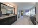 Elegant bathroom with a large soaking tub, double vanity, and walk-in shower at 12609 Pensacola Ct, Riverview, FL 33579