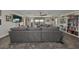 Open concept bonus room showcasing a sectional sofa and media area at 12609 Pensacola Ct, Riverview, FL 33579