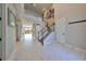 Two-story entryway with marble floors and an open staircase at 12609 Pensacola Ct, Riverview, FL 33579