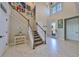 Bright two-story entryway with an open staircase and large windows at 12609 Pensacola Ct, Riverview, FL 33579