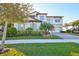 Two-story home with landscaping and a paved driveway at 12609 Pensacola Ct, Riverview, FL 33579