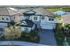 Two-story home with stone accents and a three-car garage at 12609 Pensacola Ct, Riverview, FL 33579