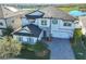Two-story home with stone accents and a three-car garage at 12609 Pensacola Ct, Riverview, FL 33579