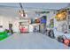 Organized garage with plenty of storage and Tesla charger at 12609 Pensacola Ct, Riverview, FL 33579