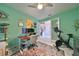 Spacious home office features built-in shelving and a view of the staircase at 12609 Pensacola Ct, Riverview, FL 33579