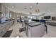 Open concept kitchen, island, stainless steel appliances, view to Gathering room at 12609 Pensacola Ct, Riverview, FL 33579