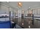 Modern kitchen with gray cabinets, stainless steel appliances and a large island at 12609 Pensacola Ct, Riverview, FL 33579