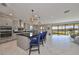 Open concept kitchen with island, stainless steel appliances and view to backyard at 12609 Pensacola Ct, Riverview, FL 33579