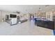 Spacious living room with sectional sofa and large TV at 12609 Pensacola Ct, Riverview, FL 33579