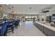 Open concept living room with view to kitchen and backyard at 12609 Pensacola Ct, Riverview, FL 33579