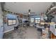 Home office features a standing desk, ample shelving, and collectibles at 12609 Pensacola Ct, Riverview, FL 33579