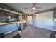 Home office with standing desk, multiple monitors, and storage at 12609 Pensacola Ct, Riverview, FL 33579