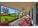 Screened porch with outdoor seating and ceiling fans at 12609 Pensacola Ct, Riverview, FL 33579