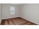 Spacious bedroom with brown carpet and neutral walls, featuring a window with blinds at 12986 Wellspring Dr, Lithia, FL 33547