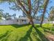 Landscaped backyard with mature trees and a private fence at 14529 102Nd Ave, Largo, FL 33774