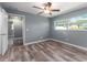 Spacious bedroom with wood-look floors and ceiling fan at 14529 102Nd Ave, Largo, FL 33774