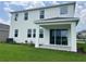 Spacious backyard featuring a covered patio with large sliding glass doors for indoor/outdoor living at 16033 7Th E Ave, Bradenton, FL 34212