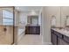 Elegant bathroom features a walk-in shower, soaking tub, double vanity with granite countertops, and modern fixtures at 16033 7Th E Ave, Bradenton, FL 34212