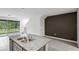 Kitchen island with granite countertops and double sink at 1648 Colt Creek Pl, Wesley Chapel, FL 33543