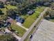 Aerial view of a home with a large yard and farmland in the background at 1827 Joe Mcintosh Rd, Plant City, FL 33565