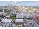 Drone shot showing modern building amongst other residential buildings and city skyline at 217 N 12Th St # 112, Tampa, FL 33602