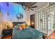 Spacious bedroom with glass block wall and ensuite bathroom access at 217 N 12Th St # 112, Tampa, FL 33602