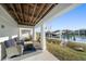 Covered patio with seating area and waterfront views at 219 18Th Ave, Indian Rocks Beach, FL 33785