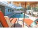 Inviting pool area with lounge chairs and patio umbrella at 2260 E Vina Del Mar Blvd, St Pete Beach, FL 33706