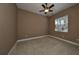 Simple bedroom with brown walls and carpet flooring at 318 Noble Faire Dr, Sun City Center, FL 33573