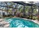 Refreshing screened pool with a spacious patio area at 3220 W Bay Vista Ave, Tampa, FL 33611