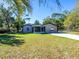 Newly renovated home with a screened porch and spacious yard at 34740 Hibiscus Dr, Dade City, FL 33523