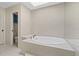 Bathroom with soaking tub and updated tile flooring at 4111 Starfish Ln # 6, Tampa, FL 33615