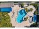 Community pool with lounge chairs and shaded areas at 4253 Golf Club Ln, Tampa, FL 33618