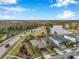 Aerial view of house and neighborhood with lake at 4539 San Martino Dr, Wesley Chapel, FL 33543