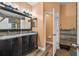 Double vanity bathroom with granite countertops and a large mirror at 5843 Justicia Loop, Land O Lakes, FL 34639