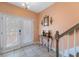 View of entryway with table, mirror, and staircase at 5843 Justicia Loop, Land O Lakes, FL 34639