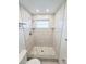 Updated shower with a large shower head and hexagon tile at 6075 Shore S Blvd # 306, Gulfport, FL 33707