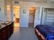 Bright bedroom with double bed, dresser, and access to bathroom and closets at 6960 20Th N Ave # 501, St Petersburg, FL 33710