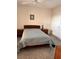 Bedroom with double bed and wood furniture at 6960 20Th N Ave # 501, St Petersburg, FL 33710