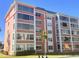 Orange building exterior with multiple windows and balconies at 6960 20Th N Ave # 501, St Petersburg, FL 33710