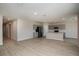 Open living room with gray kitchen cabinets and island visible at 7691 Peace Lily Ave, Wesley Chapel, FL 33545