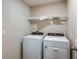 Laundry room with side-by-side washer and dryer at 7735 Peace Lily Ave, Wesley Chapel, FL 33545